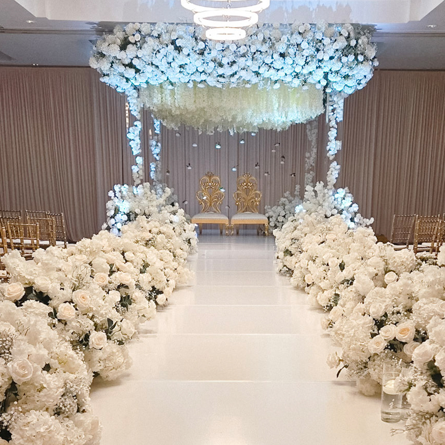 a wedding aisle with white flowers