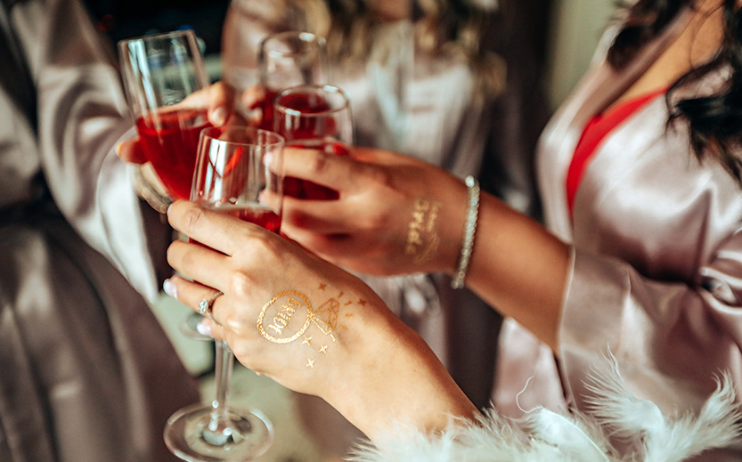 a group of women holding wine glasses
