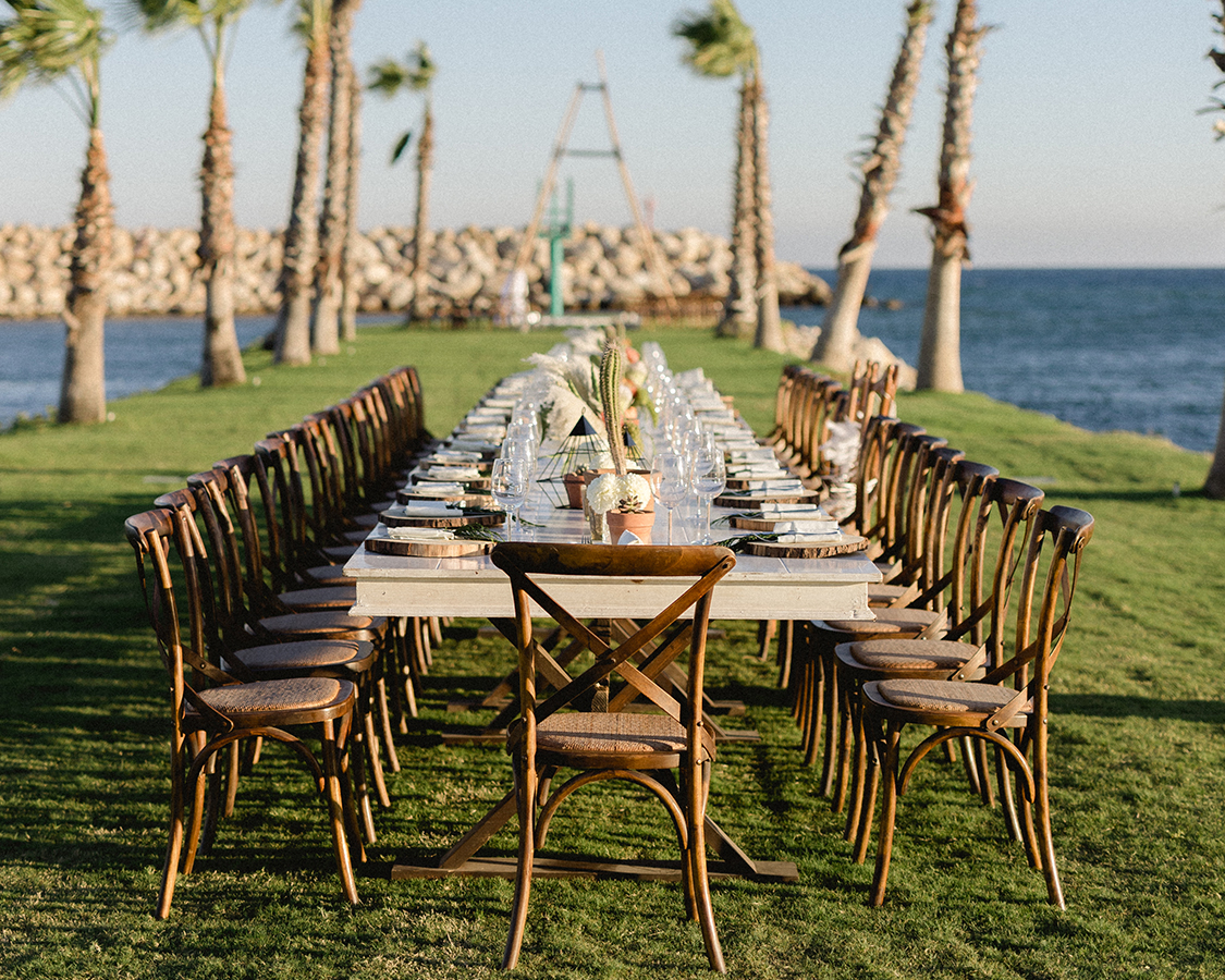 a long table set up for a dinner party