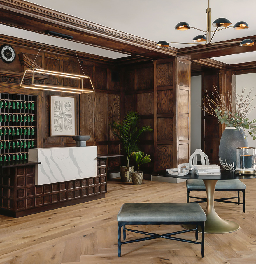 a room with wood paneling and a table and stools
