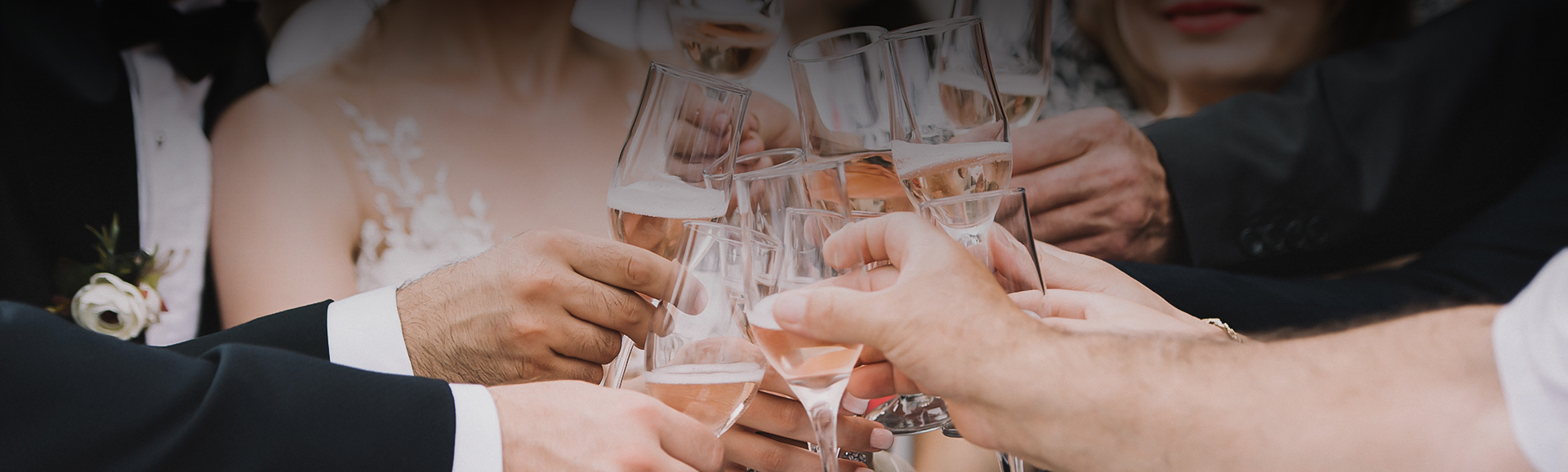 a group of people holding wine glasses