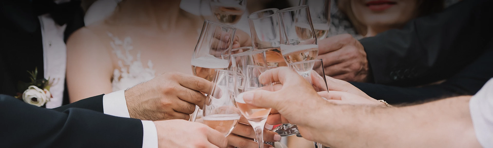 a group of people holding wine glasses