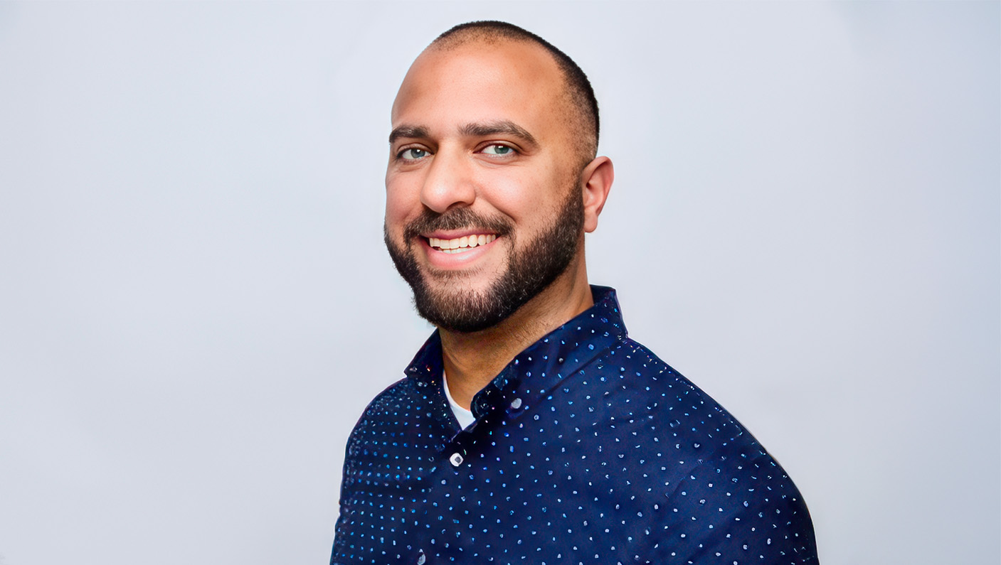 a man smiling at the camera