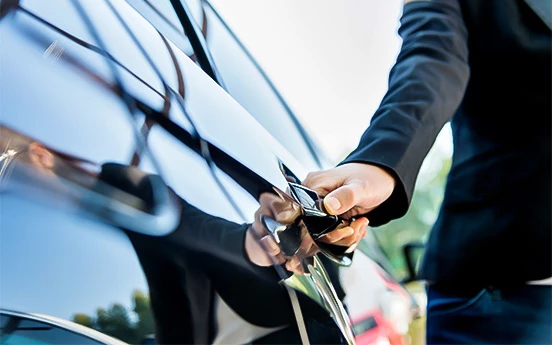 a person opening a car door