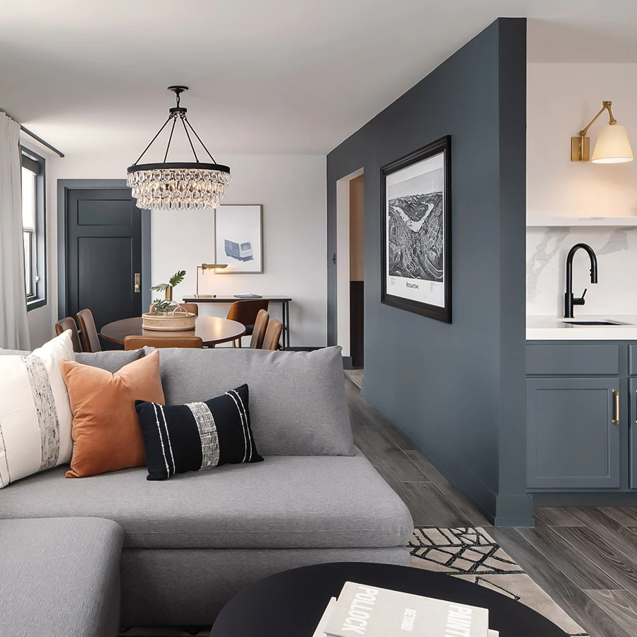 a living room with a couch and dining table