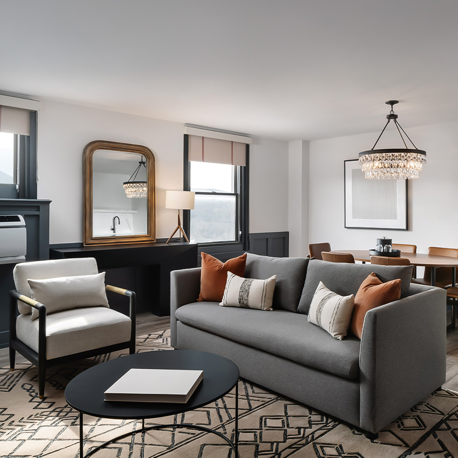 a living room with a couch and chairs