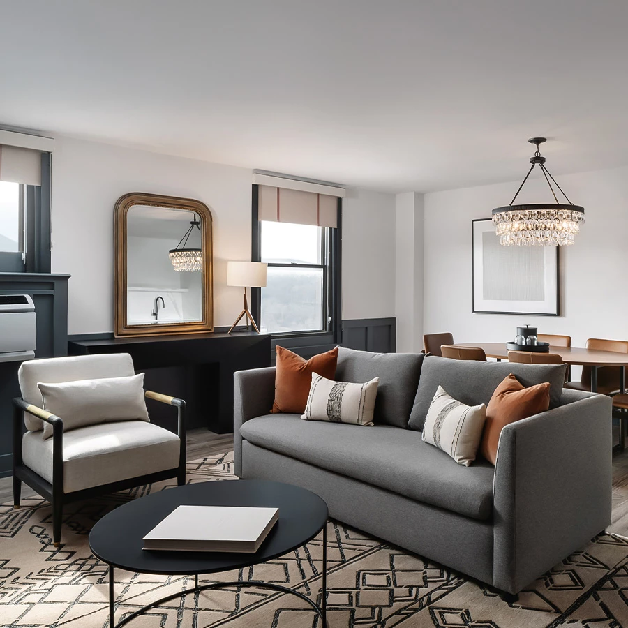 a living room with a couch and chairs
