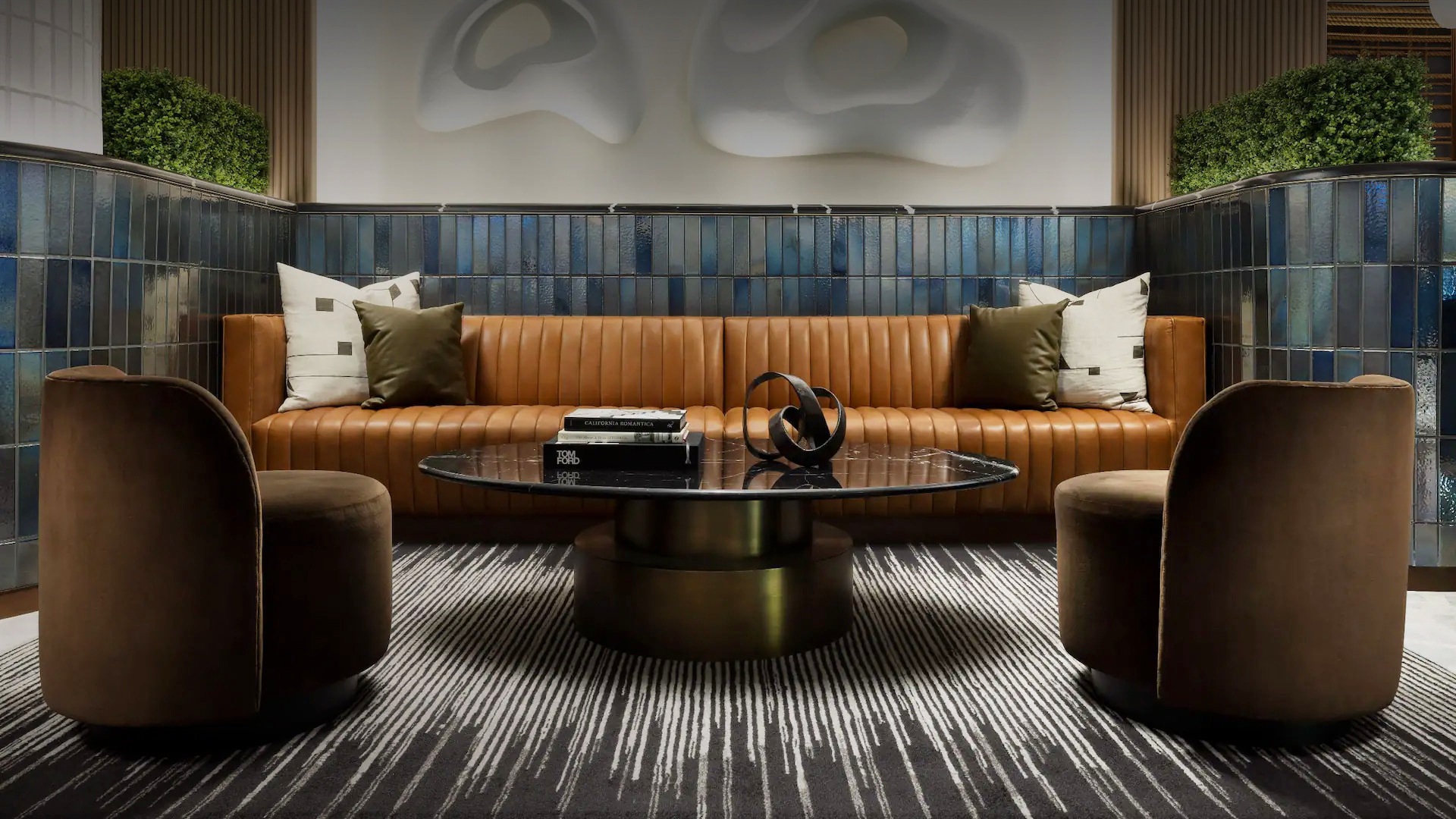 a couch with a coffee table and two chairs
