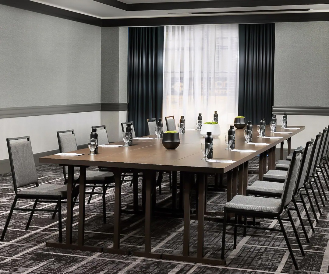 a conference room with a table and chairs