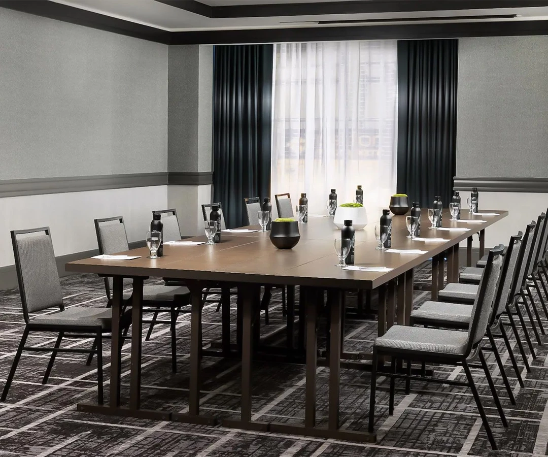 a conference room with a table and chairs