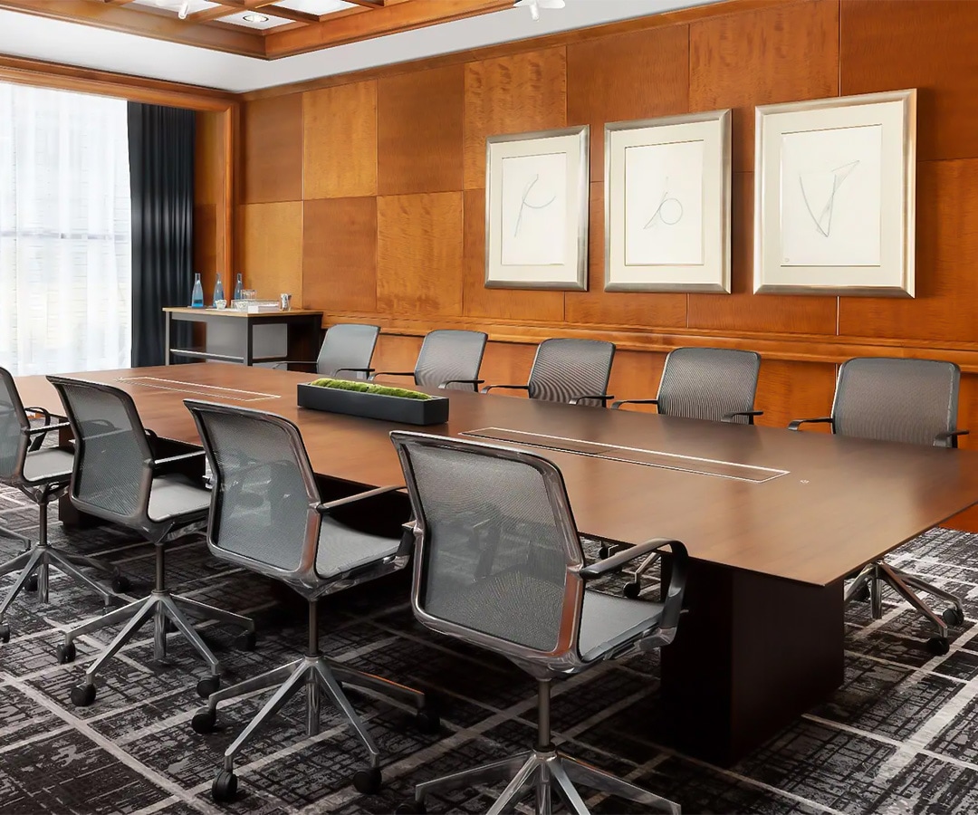a conference room with a table and chairs