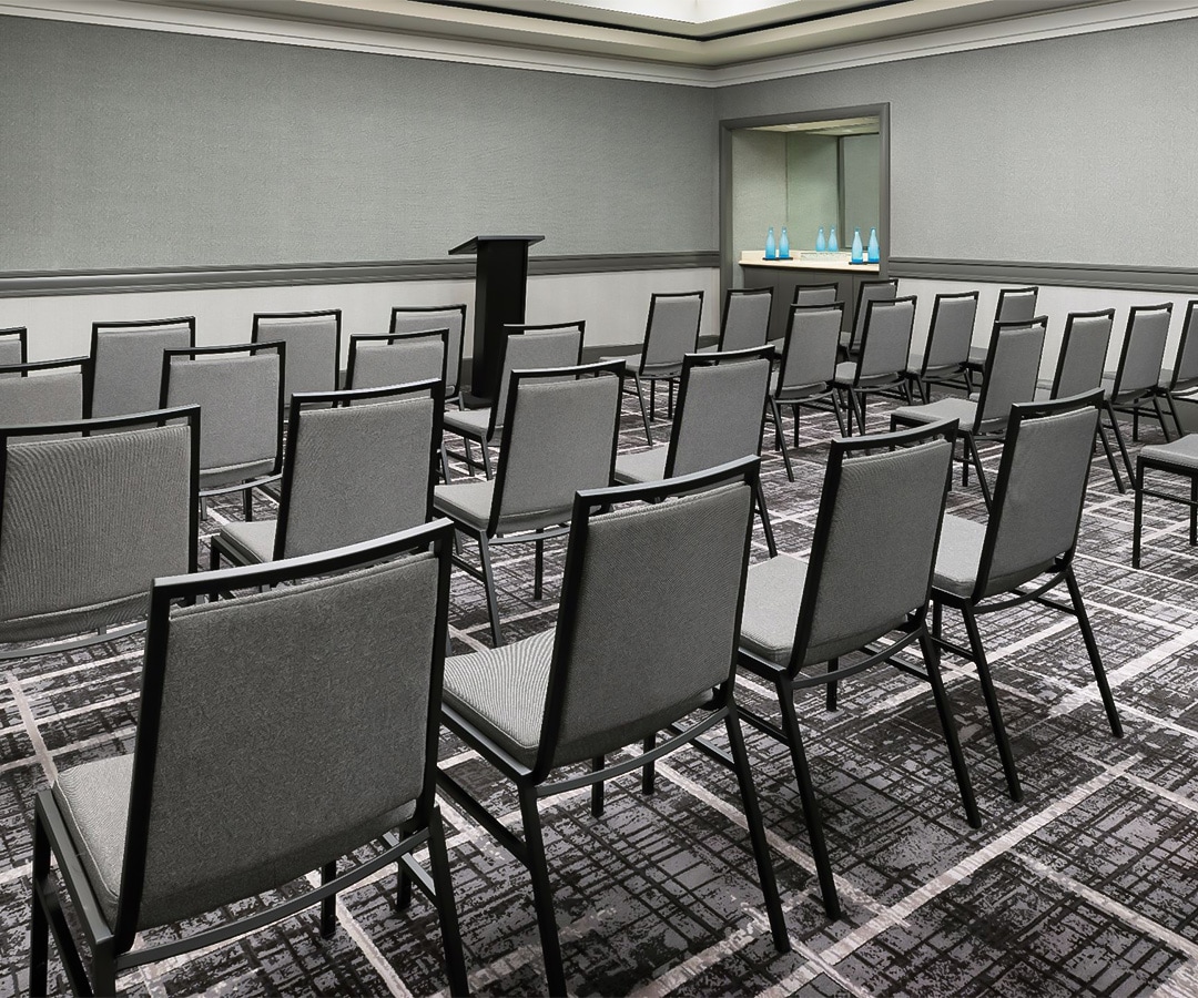 a room with chairs and a podium