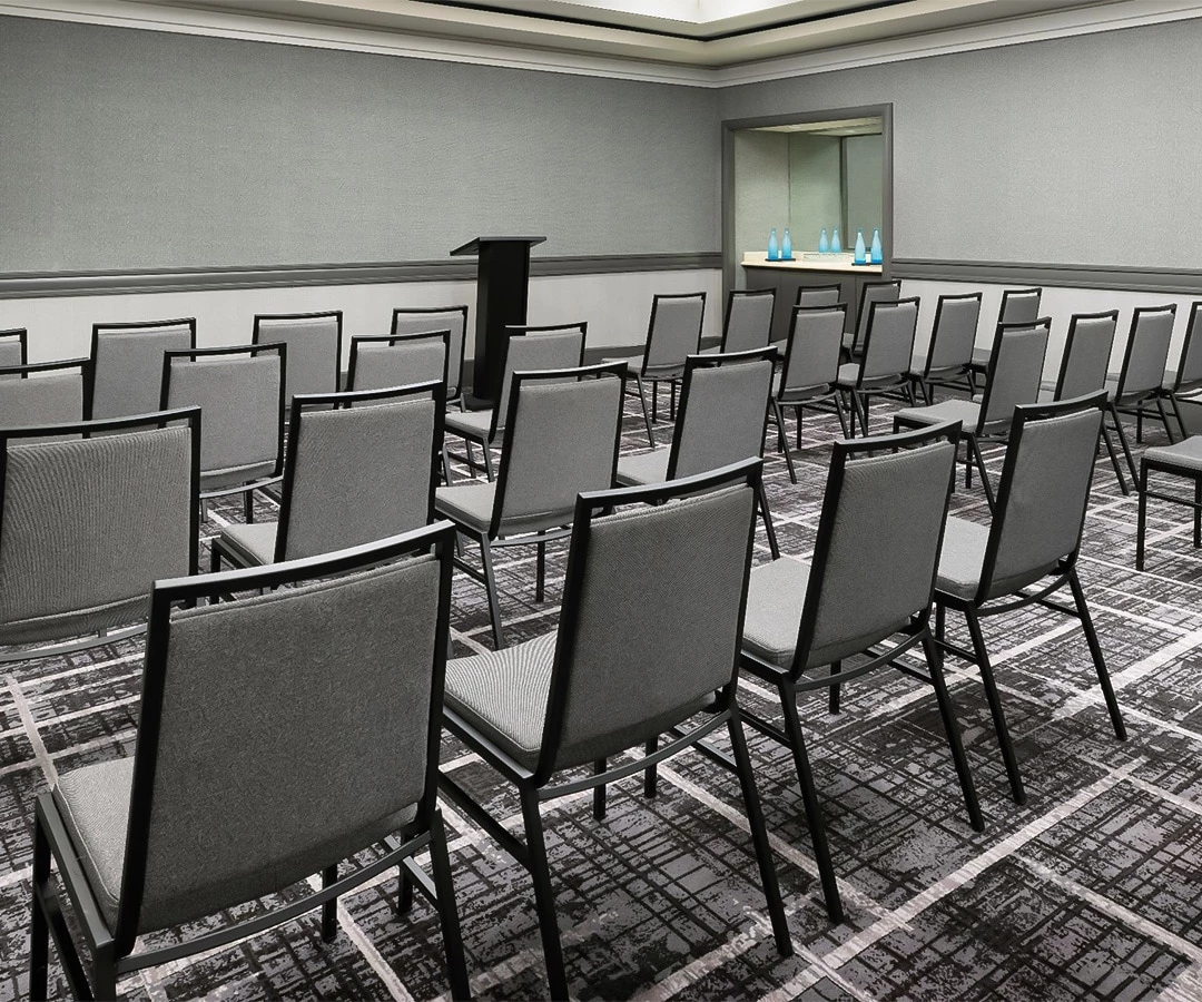 a room with chairs and a podium