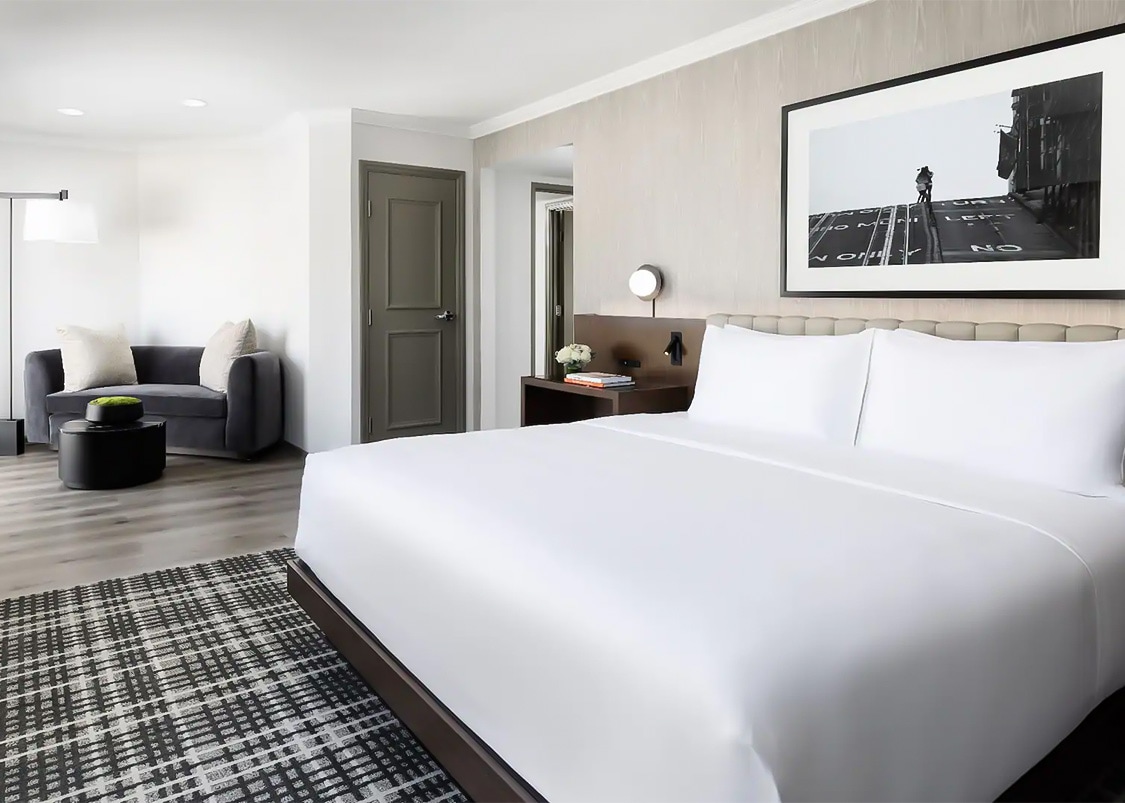 a bedroom with a bed and a couch