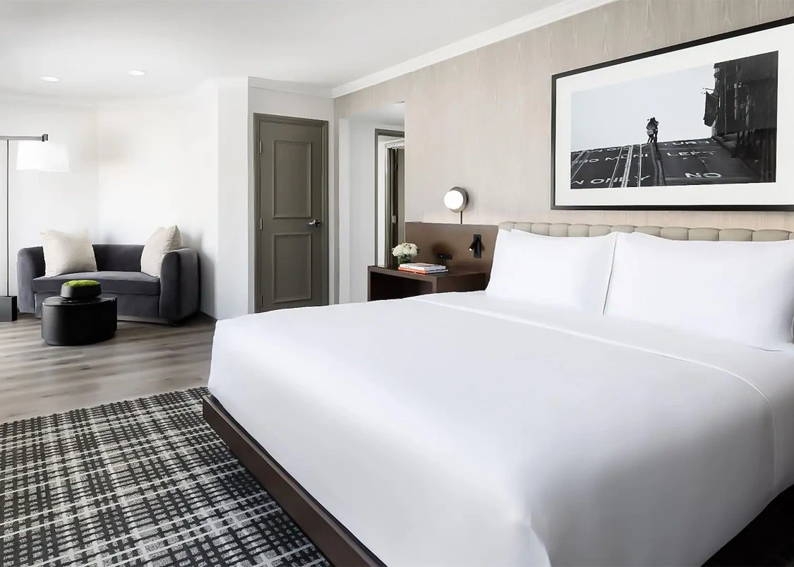 a bedroom with a bed and a couch