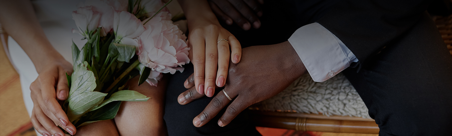 a close up of hands with rings