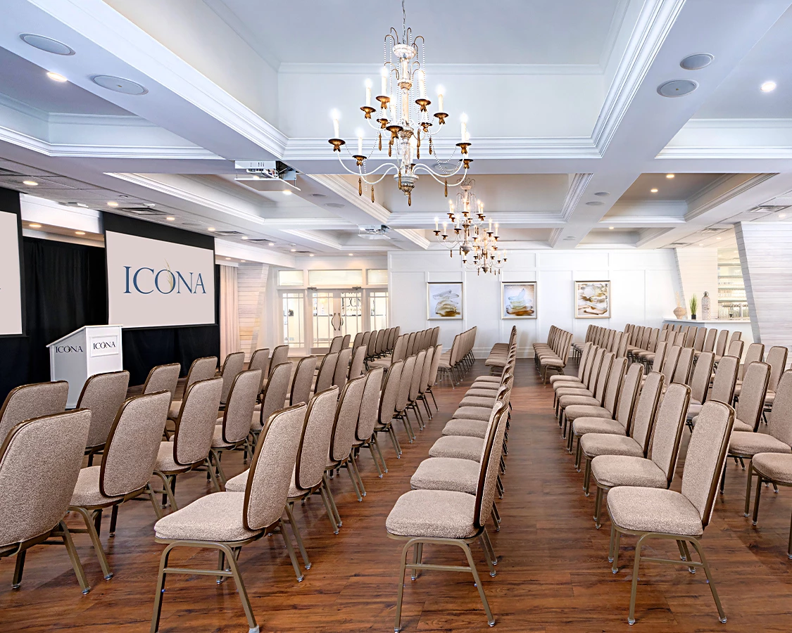a room with many chairs and chandeliers