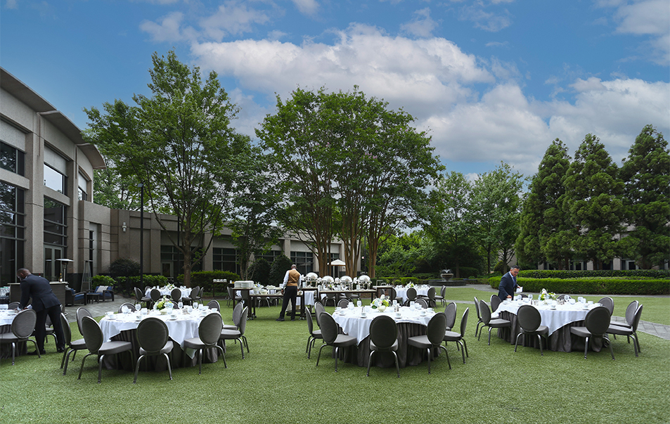 a group of tables set up in a grassy area