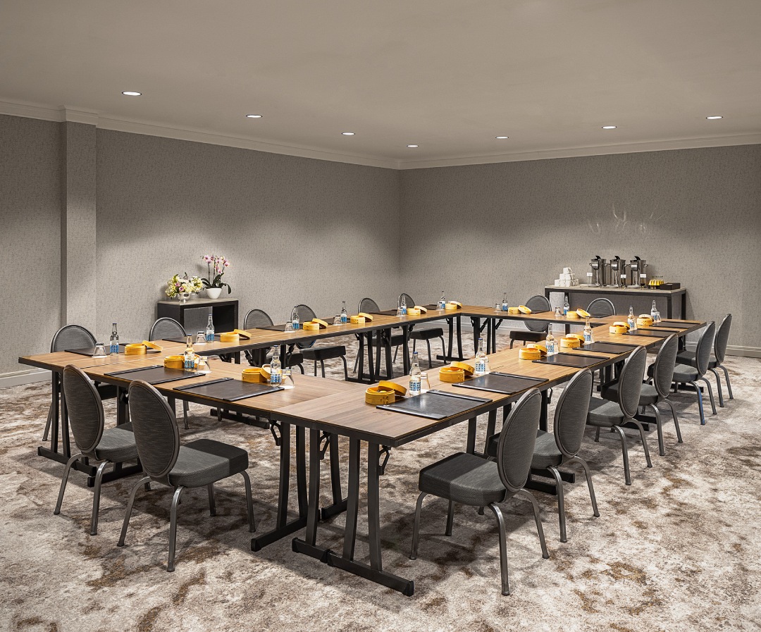 a room with a large table and chairs