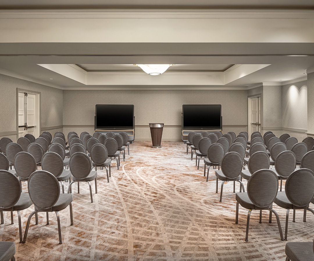 a room with chairs and a podium