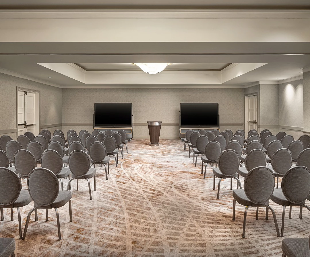a room with chairs and a podium