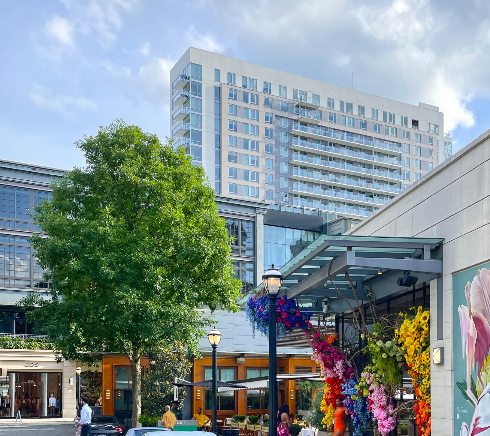 a building with a lot of flowers from the front