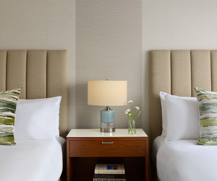 a side table next to two beds