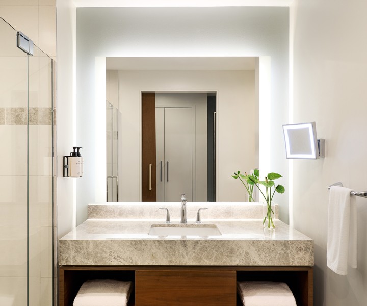 a bathroom with a sink and mirror