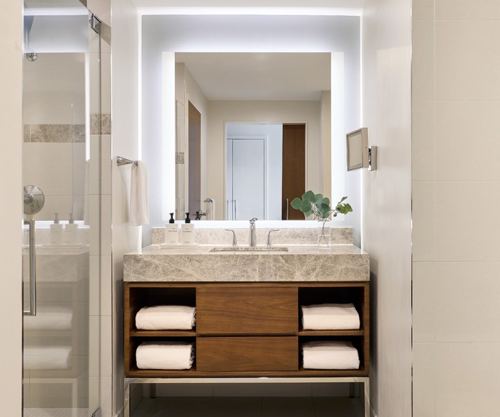a bathroom with a sink and mirror