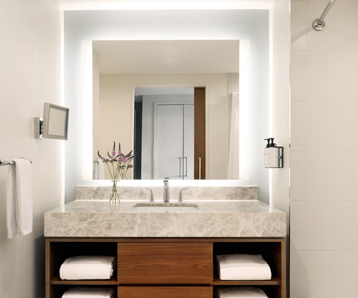 a bathroom with a mirror and sink