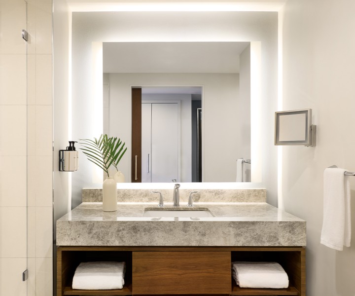 a bathroom with a sink and mirror