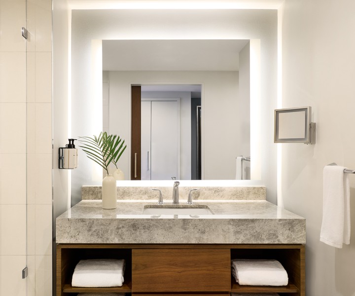 a bathroom with a sink and mirror