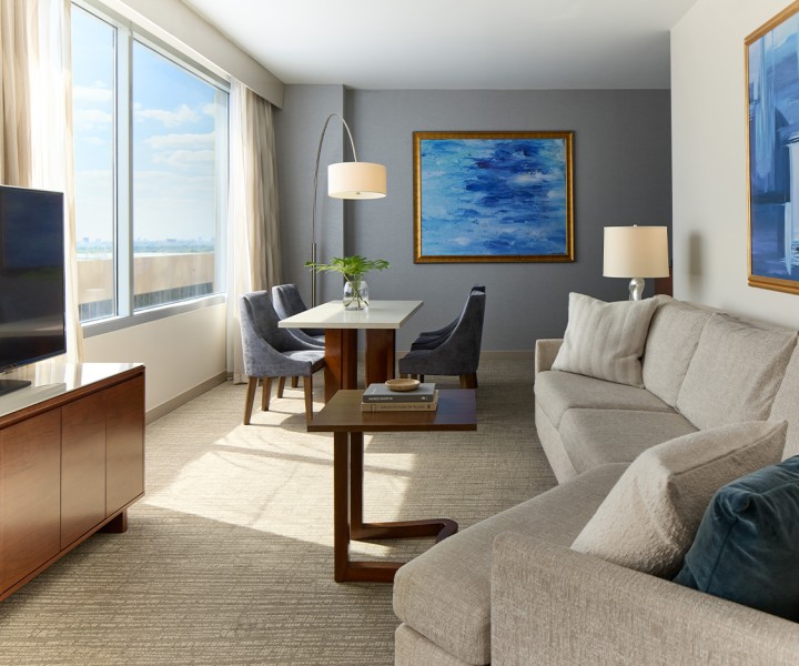a living room with couches and chairs