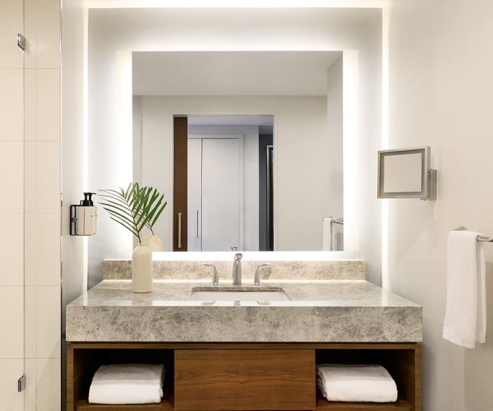 a bathroom with a sink and mirror