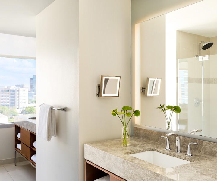 a bathroom with a sink and mirror