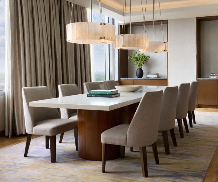 a dining room with a table and chairs
