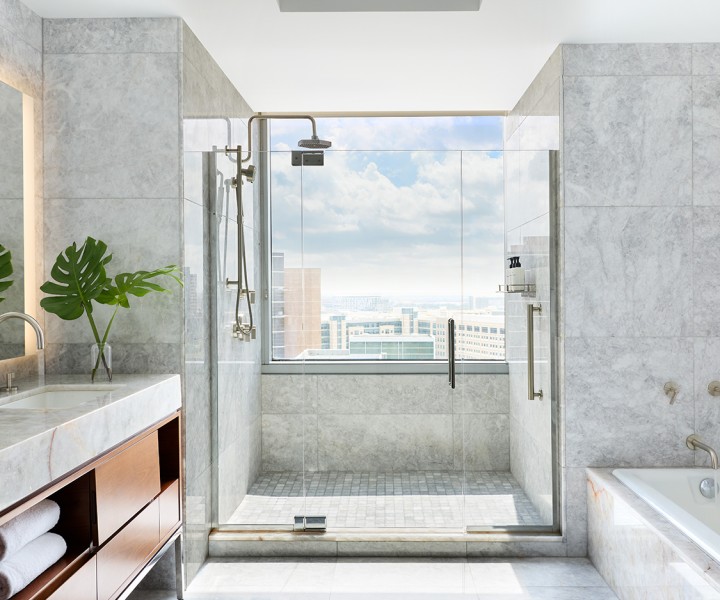 a bathroom with a glass shower and a bathtub