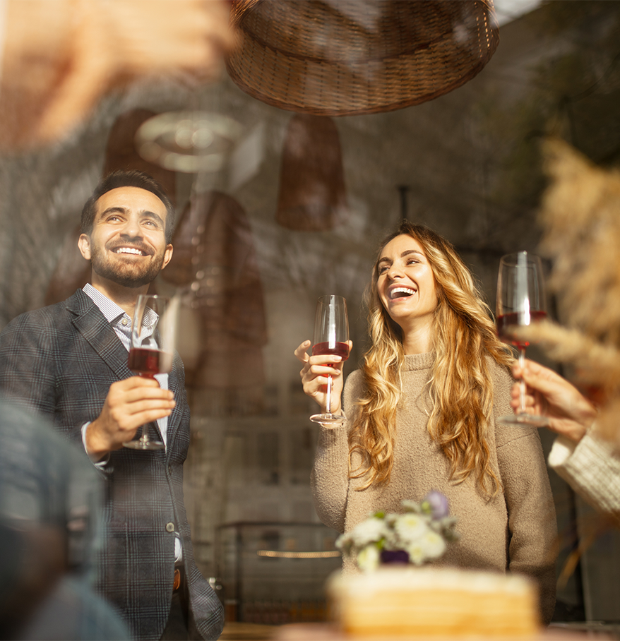 a group of people holding wine glasses