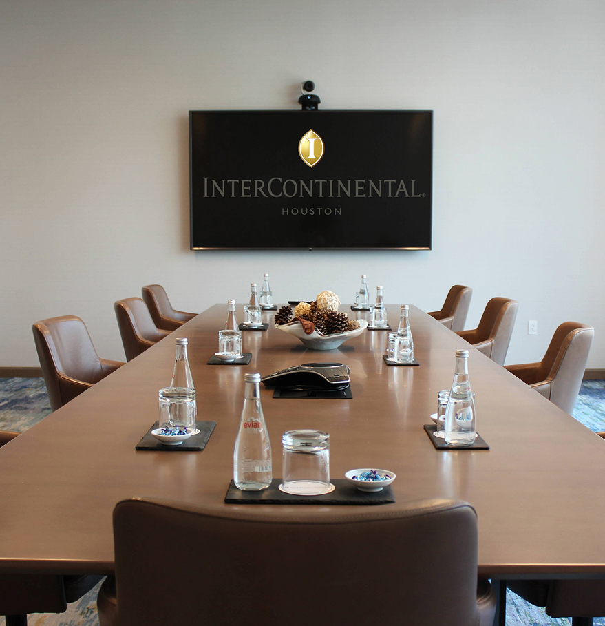 a conference room with a table and chairs