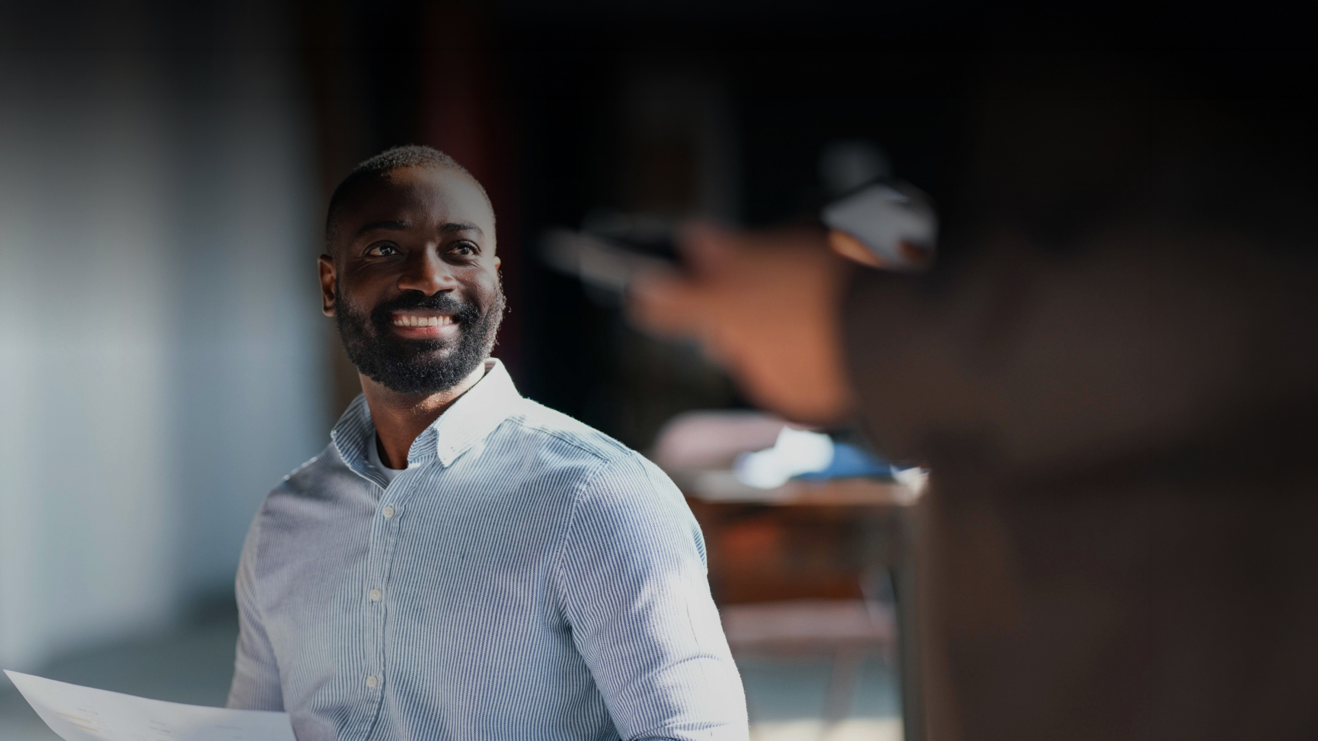 a man smiling at camera