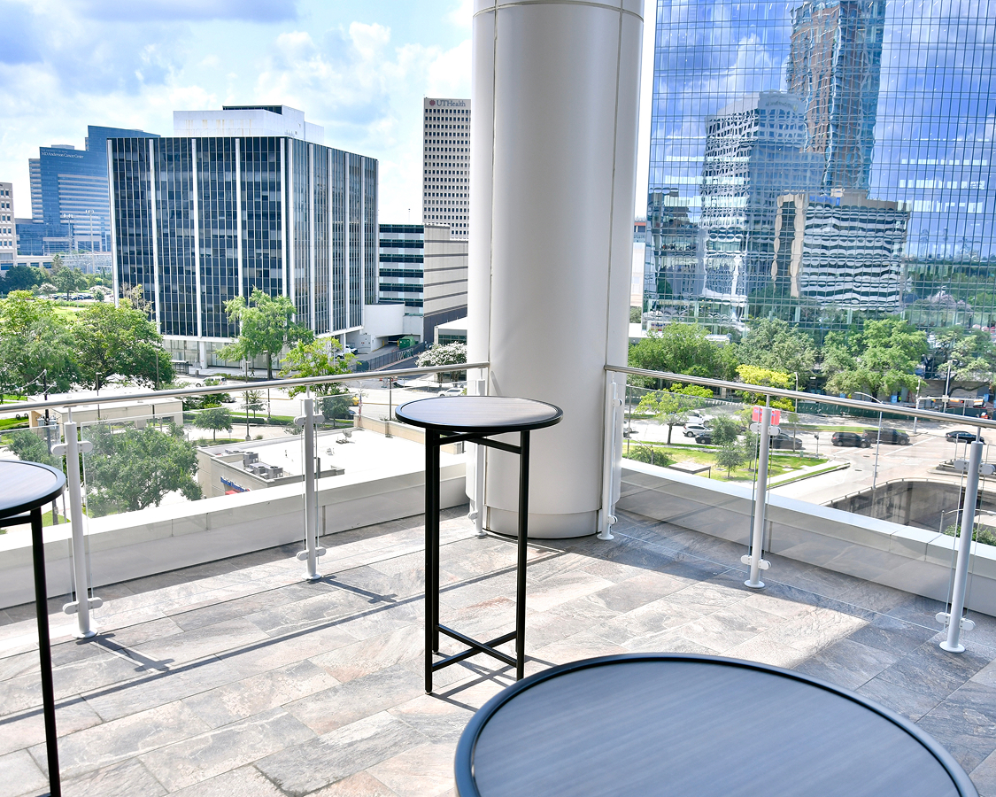 a table on a balcony with a city view