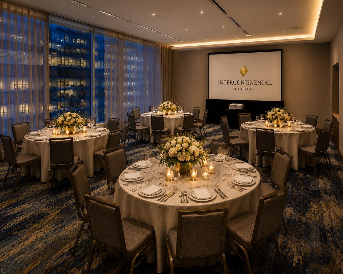 a room with tables and chairs and a projector screen
