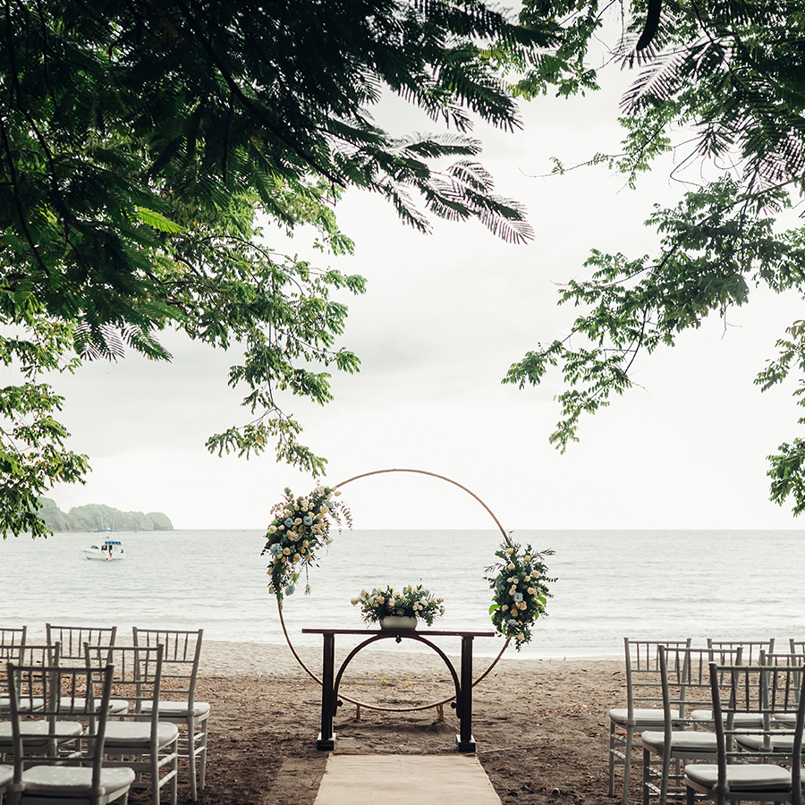 a wedding ceremony set up on the beach