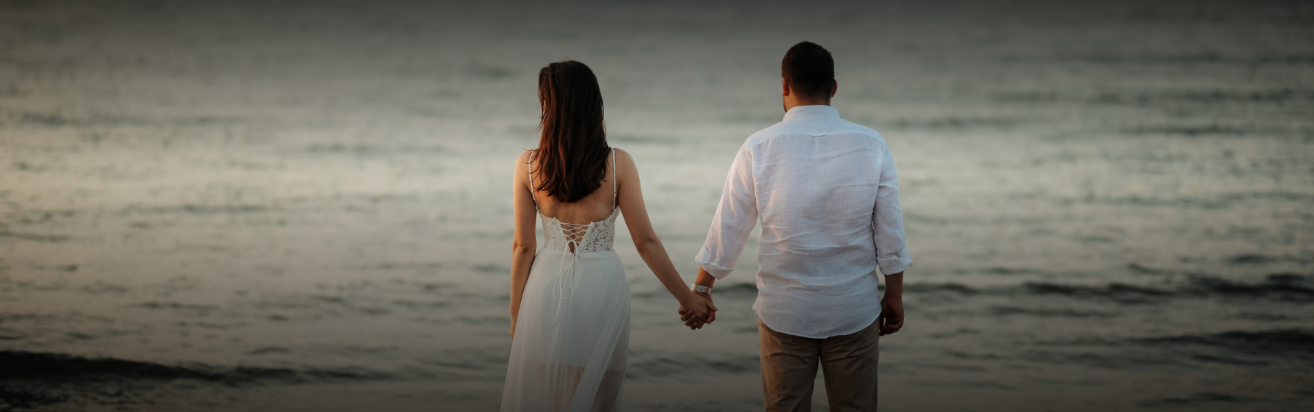a man and woman holding hands