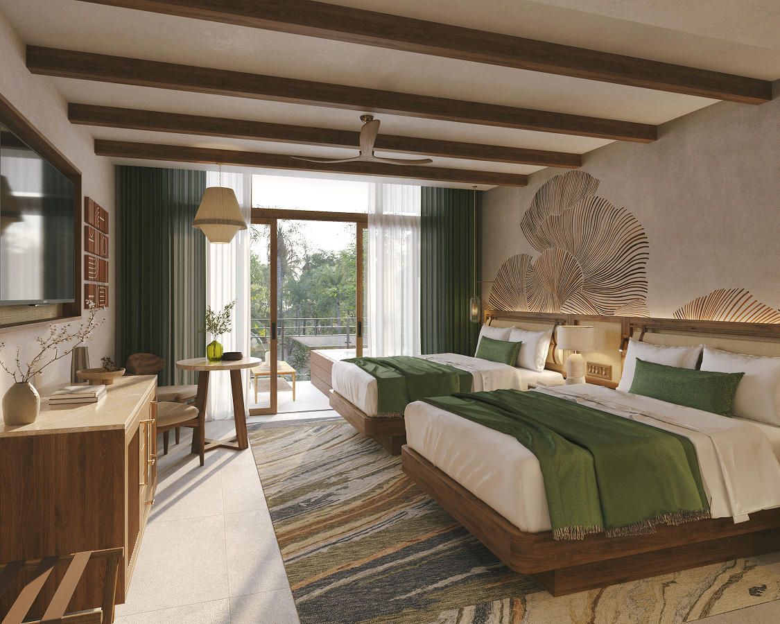 a room with two beds and a table