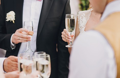 a group of people holding wine glasses