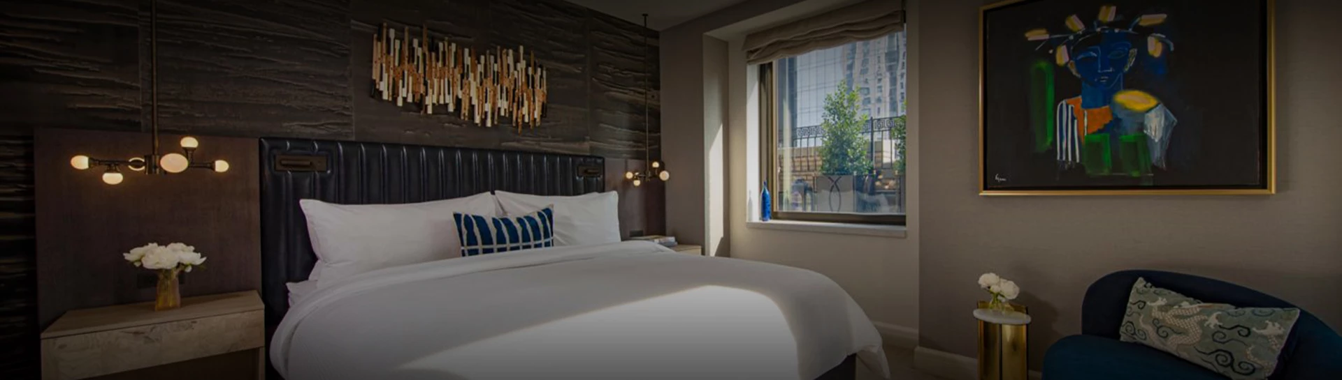 a bed with a window and a lamp
