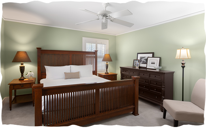 a bedroom with a bed and dresser