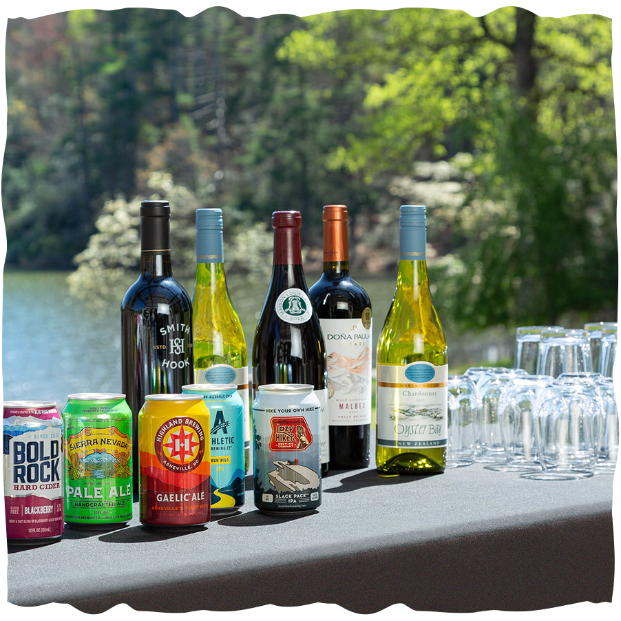 a group of bottles and cans of beer on a table