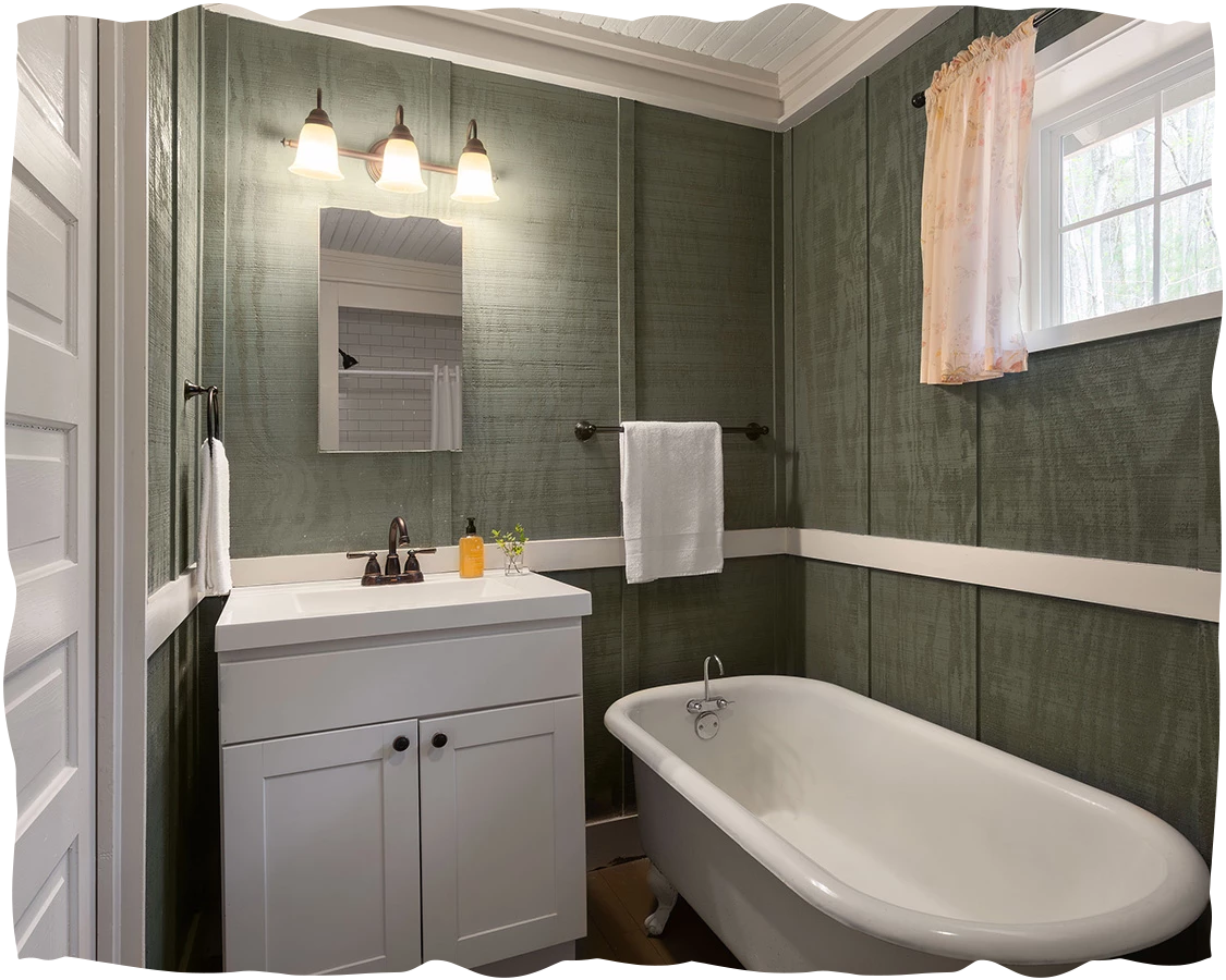 a bathroom with a tub sink and a mirror